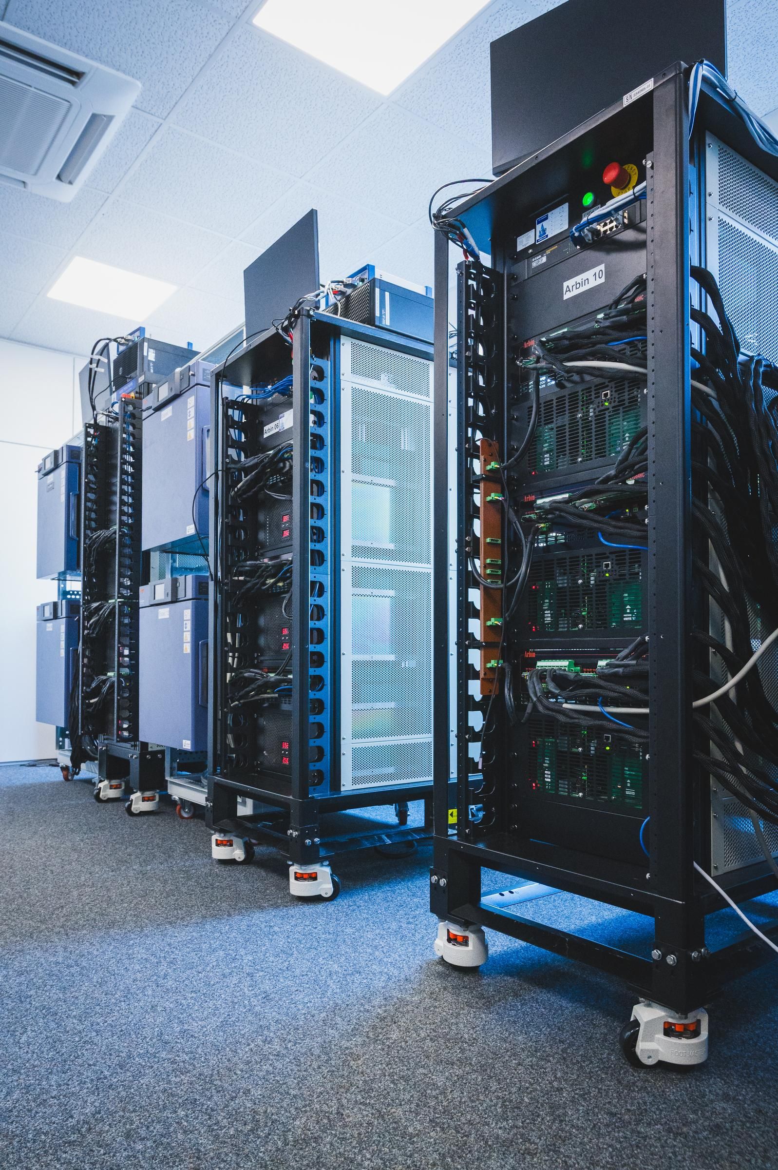 Test bench racks with channel wiring and perforated panels